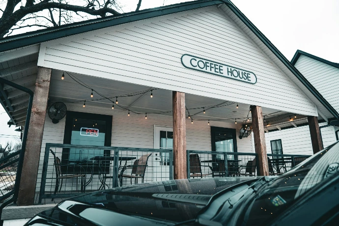 a car parked outside of a coffee house